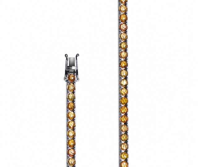 Coroné yellow sapphire option, official close-up of the rose-cut stones and white-gold clasp