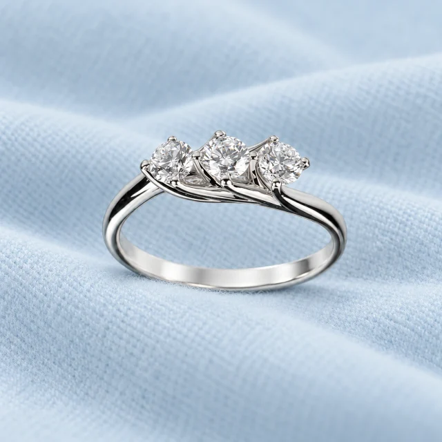 Flower Trilogy Ring on pale ice-blue cashmere
