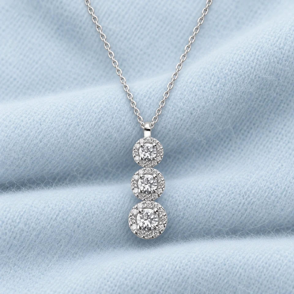 Jennifer Trilogy Pendant on softly folded pale ice-blue cashmere