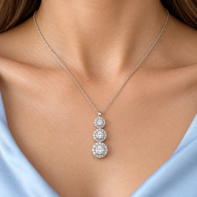 Jennifer Trilogy Pendant worn at the collarbone with pale-blue silk