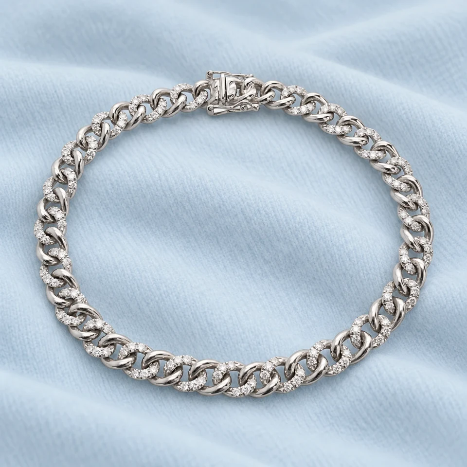 Liaison White-Gold Bracelet on softly folded pale ice-blue cashmere