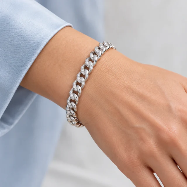 Liaison White-Gold Bracelet worn on the wrist beside a pale-blue sleeve