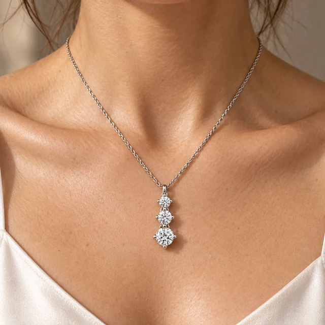 The Three-Stone Pendant worn at the collarbone